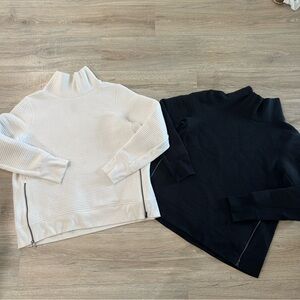 All in motion black and white side zip pullovers sweaters